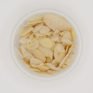 Natural Sliced Blanched Almonds In Small White Container On White Background