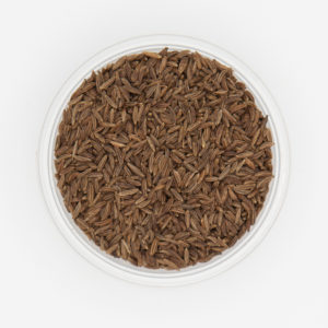 Up Close Photo Of Caraway Seeds In Small Dish On White Background