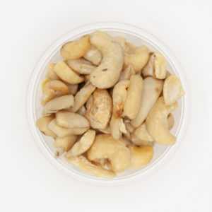 Large Raw Cashews Up Close Texture From Above On White Background