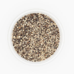 Close up shot of ground black pepper multicolored Italian mix in 18 mesh in a container on a white background