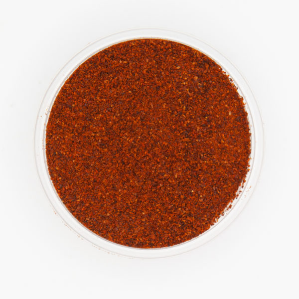 Ground Chipotle Pepper Detailed Textures From Above On White Background
